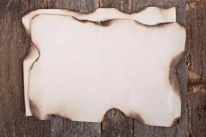 Old burnt paper on wood texture